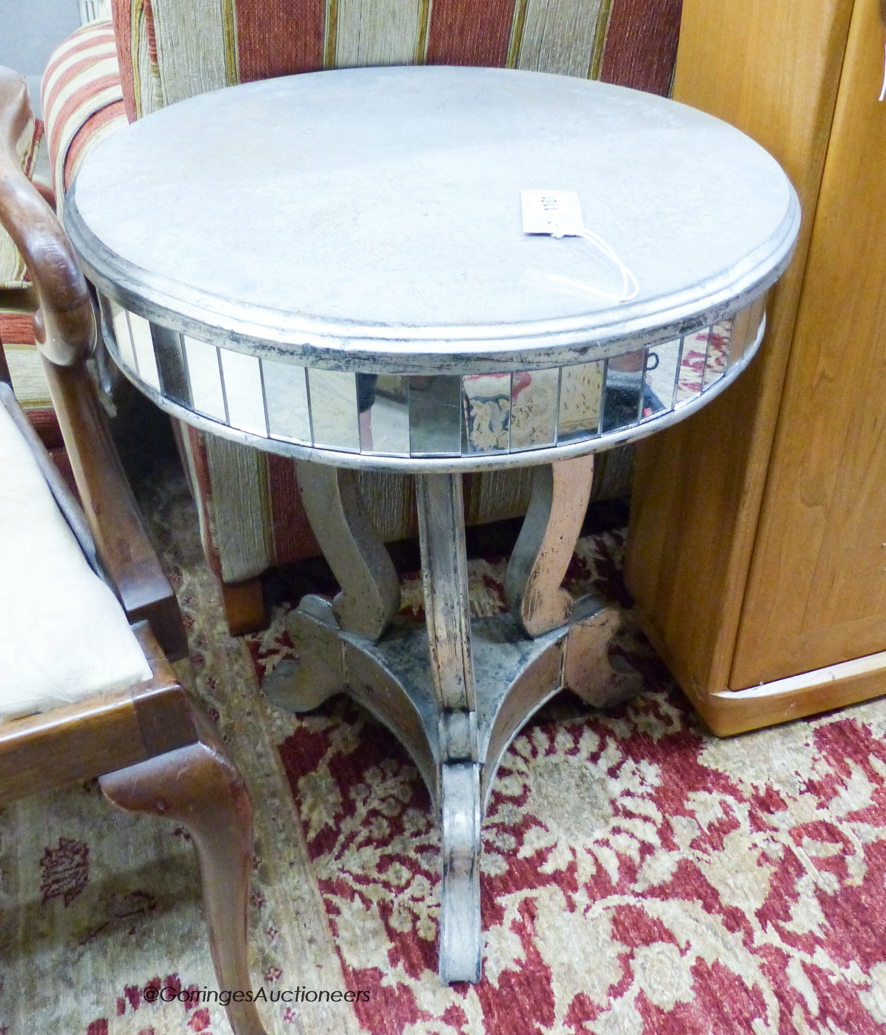 A circular mirrored occasional table, 48cm diameter, height 65cm